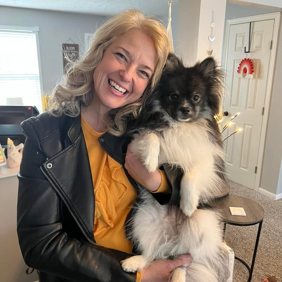 Jennifer holding her dog Teddy
